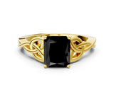 Yellow gold Fancy Black Radiant Cut Diamond Solitaire Engagement Ring with Celtic Knot Band and Four-Prong Setting
