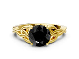 Yellow gold Fancy Black Round Cut Diamond Solitaire Engagement Ring with Celtic Knot Band and Four-Prong Setting