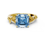 Yellow gold Fancy Blue Asscher  Brilliant Solitaire with Leaf Motif Band and Four-Prong Setting