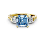 Yellow gold Fancy Blue Asscher Cut Brilliant Three-Stone Pave Band with Four-Prong Setting