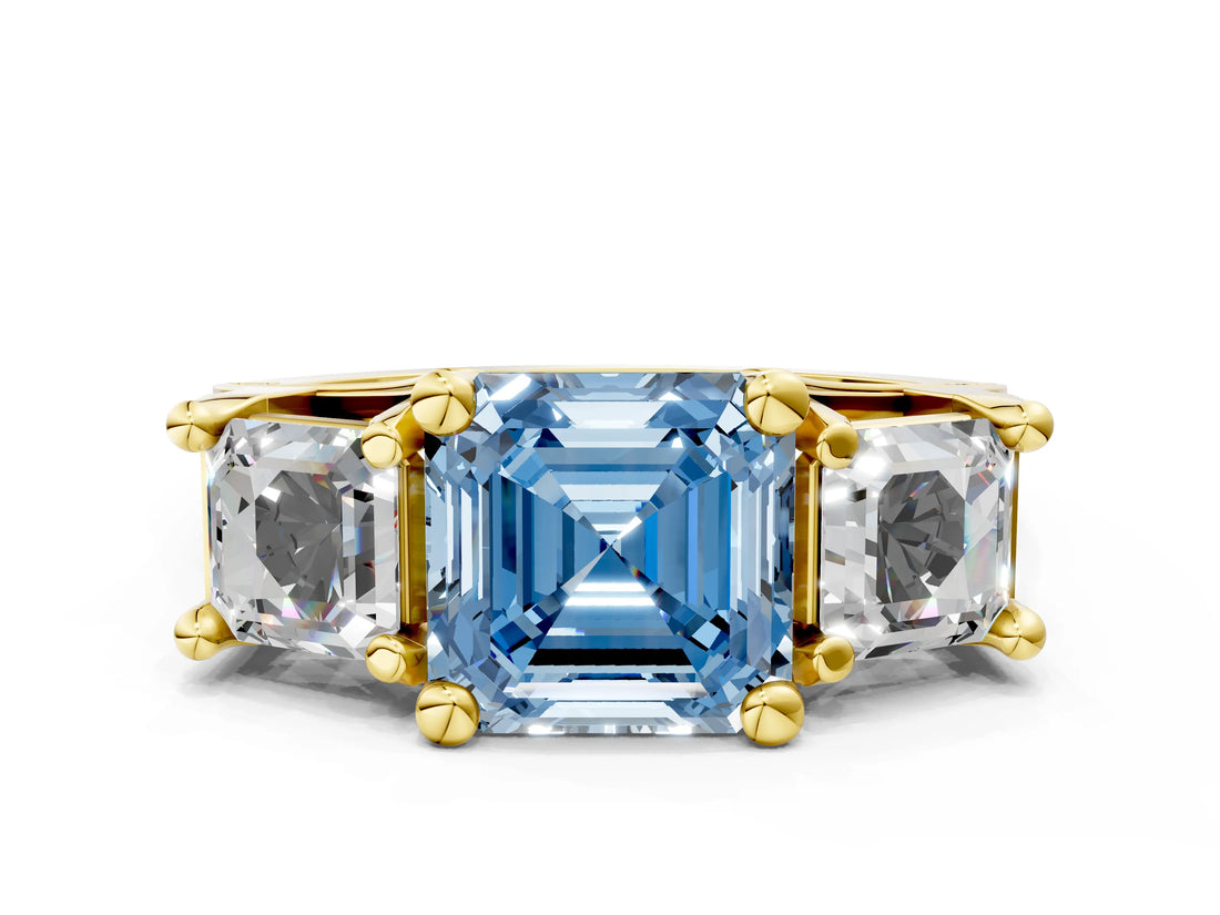 Yellow gold Fancy Blue Asscher Cut Diamond Three-Stone Ring with Channel Set Band and Four-Prong Setting_56