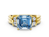 Yellow gold Fancy Blue Asscher  Cut Three-Stone Channel Set Ring with Bar Prongs