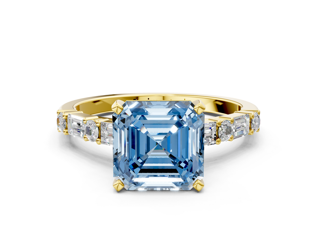 Yellow gold Fancy Blue Asscher  Solitaire with Side Baguettes and Channel Set Band