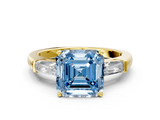 Yellow gold Fancy Blue Asscher  Solitaire with Tapered Baguette Side Stones on a Classic Band with Four-Prong Setting