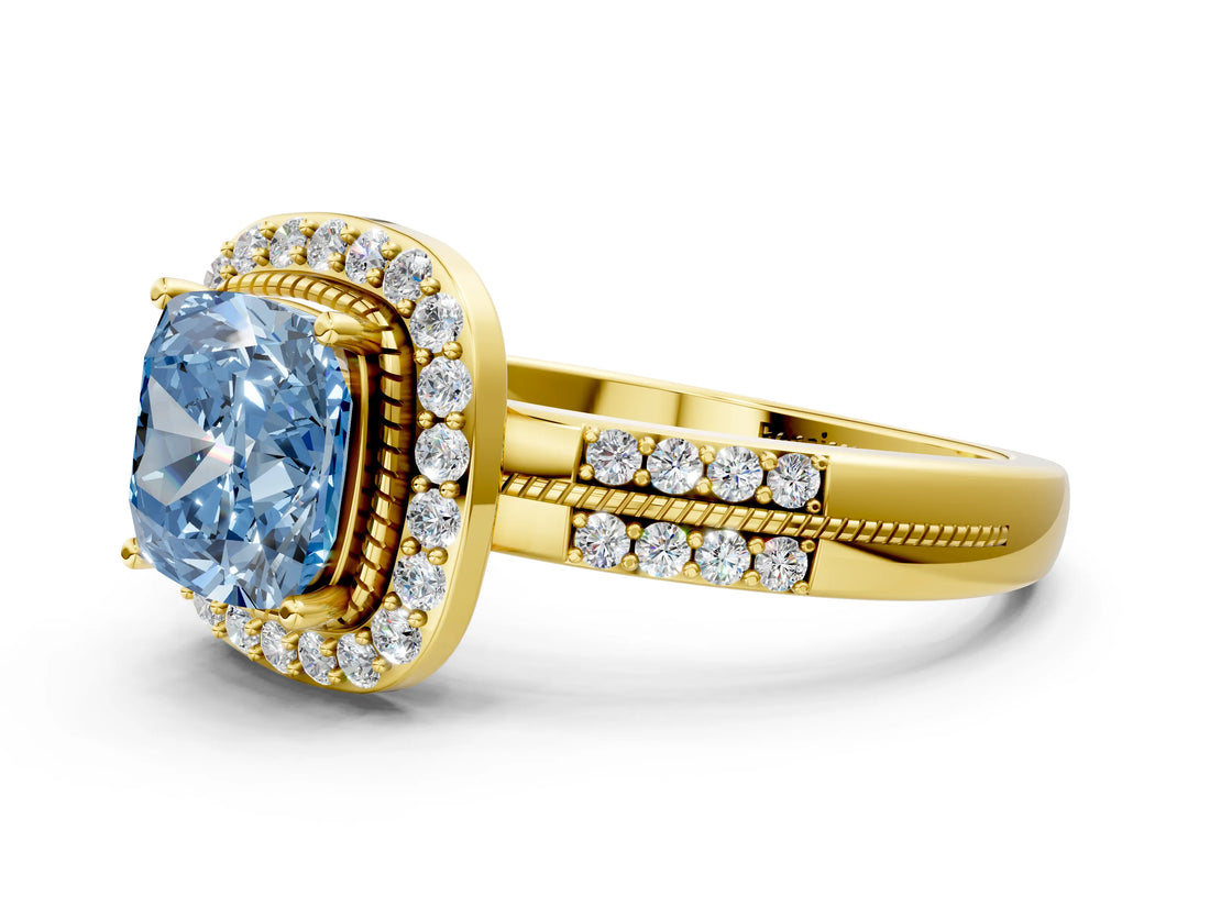 Yellow gold Fancy Blue Cushion Cut Diamond Double Halo Ring with Split Shank and Four-Prong Setting