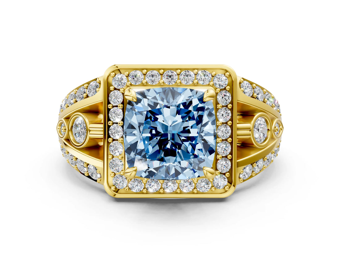 Yellow gold Fancy Blue Cushion Cut Diamond Halo Ring with Split Shank and Bezel Accents and Four-Prong Setting