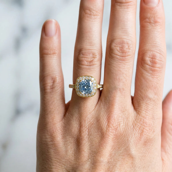 Yellow gold Fancy Blue Cushion Cut Diamond Halo Ring with Split Shank and Four-Prong Setting