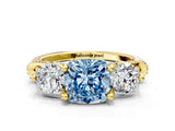 Yellow gold Fancy Blue Cushion Cut Diamond Three-Stone Ring with Prong Setting and Pavé Band