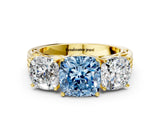 Yellow gold Fancy Blue Cushion Cut Diamond Three-Stone Ring with Prong Setting and Textured Band