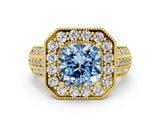 Yellow gold Fancy Blue Cushion Cut Halo Diamond Engagement Ring with Pave Split Shank and Four-Prong Setting