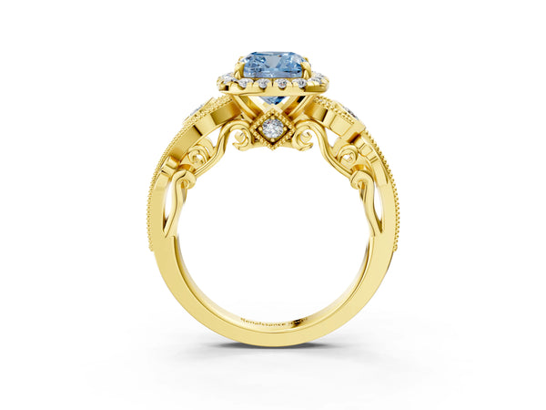Yellow gold Fancy Blue Cushion Cut Halo Diamond Ring with Milgrain and Bezel Accents on a Split Shank Band