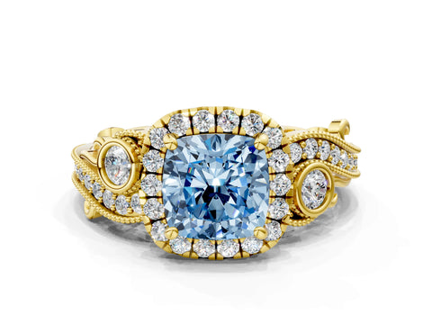 Yellow gold Fancy Blue Cushion Cut Halo Diamond Ring with Milgrain and Bezel Accents on a Split Shank Band
