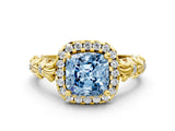 Yellow gold Fancy Blue Cushion Cut Halo Diamond Solitaire with Filigree Band and Four-Prong Setting