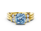 Yellow gold Fancy Blue Cushion  Cut Three-Stone Channel Set Ring with Bar Prongs_59