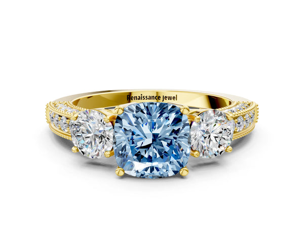 Yellow gold Fancy Blue Cushion Cut Three-Stone Diamond Ring with Pavé Band and Four-Prong Setting