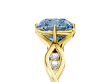 Yellow gold Fancy Blue Cushion  Solitaire Twist Band with Leaf Prong Setting