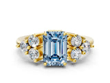 Yellow gold Fancy Blue Emerald Cut Brilliant Diamond Cluster Accent Solitaire Ring with Prong Setting