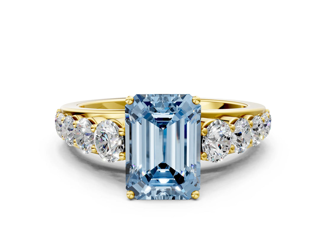 Yellow gold Fancy Blue Emerald Cut Brilliant Diamond Pavé Band with Six-Prong Setting