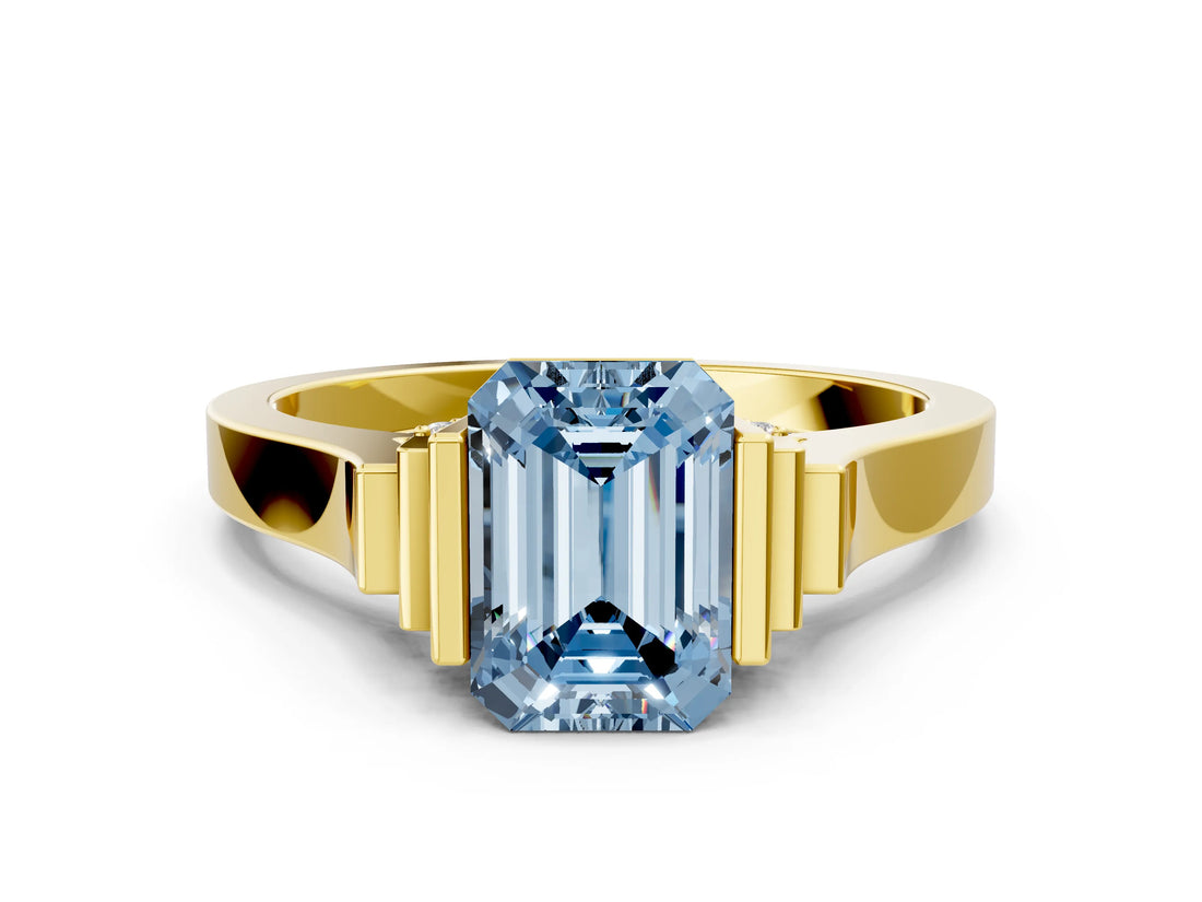 Yellow gold Fancy Blue Emerald Cut Brilliant Solitaire Diamond Ring with Channel Set Band and Bar Prong Setting