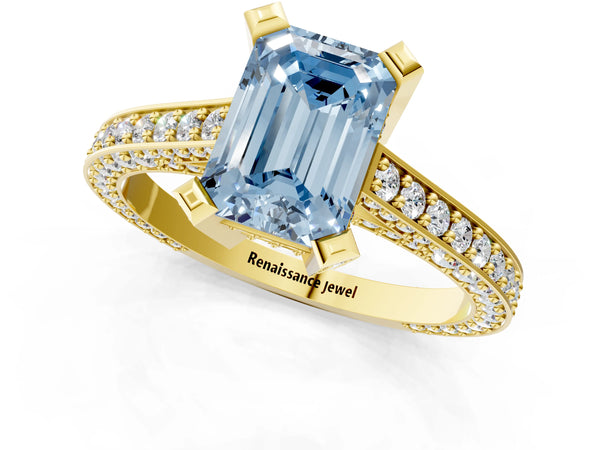 Yellow gold Fancy Blue Emerald Cut Brilliant Split Shank Pave Solitaire Ring with Four-Prong Setting