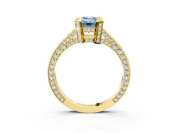 Yellow gold Fancy Blue Emerald Cut Brilliant Split Shank Pave Solitaire Ring with Four-Prong Setting