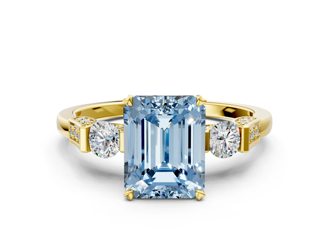 Yellow gold Fancy Blue Emerald Cut Brilliant Three-Stone Pave Band with Four-Prong Setting