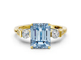Yellow gold Fancy Blue Emerald Cut Brilliant Three-Stone Pave Band with Four-Prong Setting