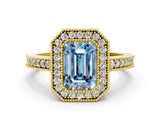 Yellow gold Fancy Blue Emerald Cut-Cut Diamond Halo Engagement Ring with Pave Band and Prong Setting