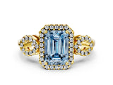 Yellow gold Fancy Blue Emerald Cut Cut Halo Diamond Infinity Band with Four-Prong Setting