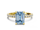 Yellow gold Fancy Blue Emerald Cut Diamond Brilliant Solitaire Ring with Pavé Band and Four-Prong Setting
