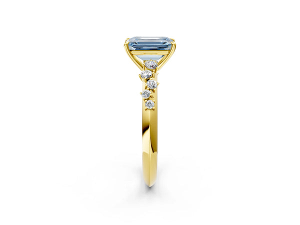 Yellow gold Fancy Blue Emerald Cut Diamond Cluster Side Stone Solitaire Ring with Prong Setting