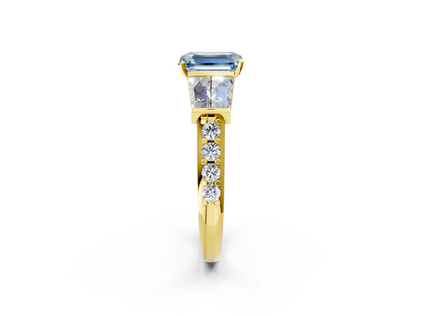 Yellow gold Fancy Blue Emerald Cut Diamond Engagement Ring with Baguette Side Stones and Channel Set Band