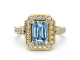 Yellow gold Fancy Blue Emerald Cut Diamond Halo Ring with Pavé Band and Prong Setting
