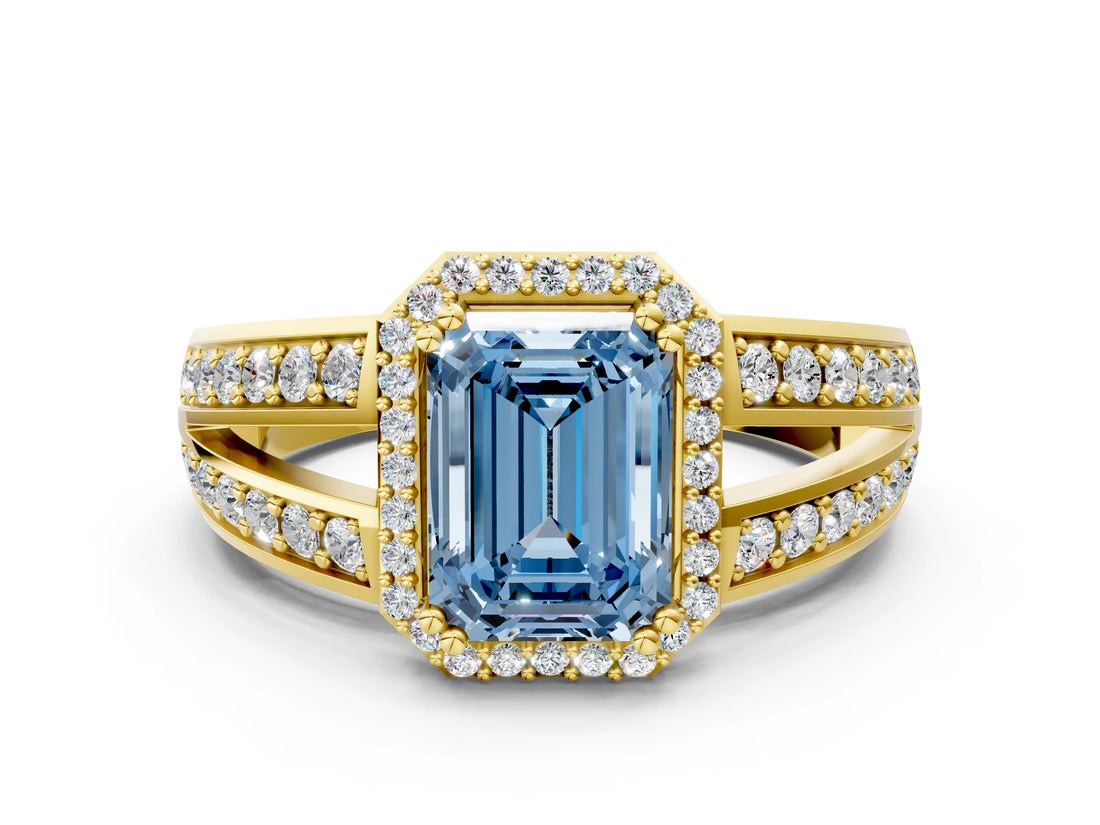 Yellow gold Fancy Blue Emerald Cut Diamond Halo Ring with Split Shank Pavé Band and Four-Prong Setting