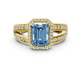 Yellow gold Fancy Blue Emerald Cut Diamond Halo Ring with Split Shank Pavé Band and Four-Prong Setting