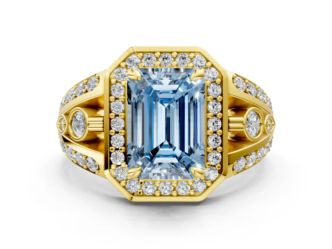 Yellow gold Fancy Blue Emerald Cut Diamond Halo Ring with Split Shank and Bezel Accents and Four-Prong Setting
