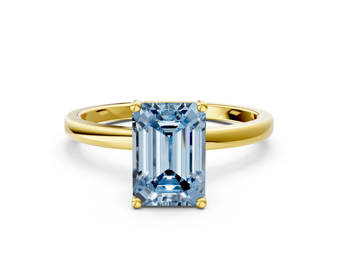 Yellow gold Fancy Blue Emerald Cut Diamond Solitaire Ring with Classic Band and Four-Prong Setting