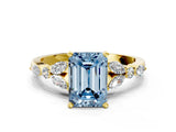 Yellow gold Fancy Blue Emerald Cut Diamond Solitaire Ring with Side Stones and Four-Prong Setting_243