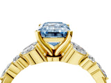 Yellow gold Fancy Blue Emerald Cut Diamond Solitaire Ring with Side Stones and Four-Prong Setting_247