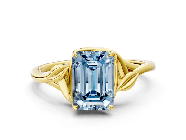Yellow gold Fancy Blue Emerald Cut Diamond Solitaire Ring with Twist Band and Four-Prong Setting