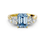 Yellow gold Fancy Blue Emerald Cut Diamond Three-Stone Engagement Ring with Prong Setting and Pavé Band