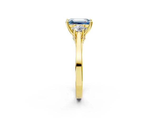 Yellow gold Fancy Blue Emerald Cut Diamond Three-Stone Engagement Ring with Prong Setting and Pavé Band