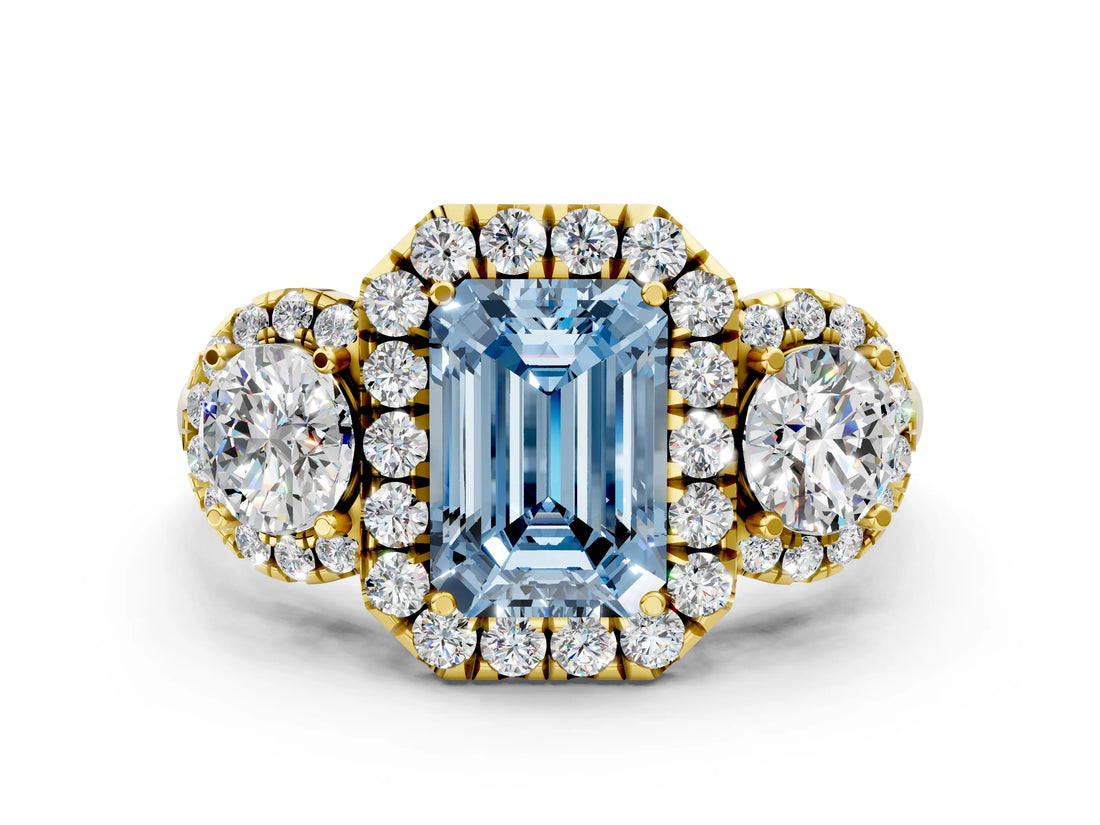 Yellow gold Fancy Blue Emerald Cut Diamond Three-Stone Halo Ring with Prong Setting and Pavé Accents