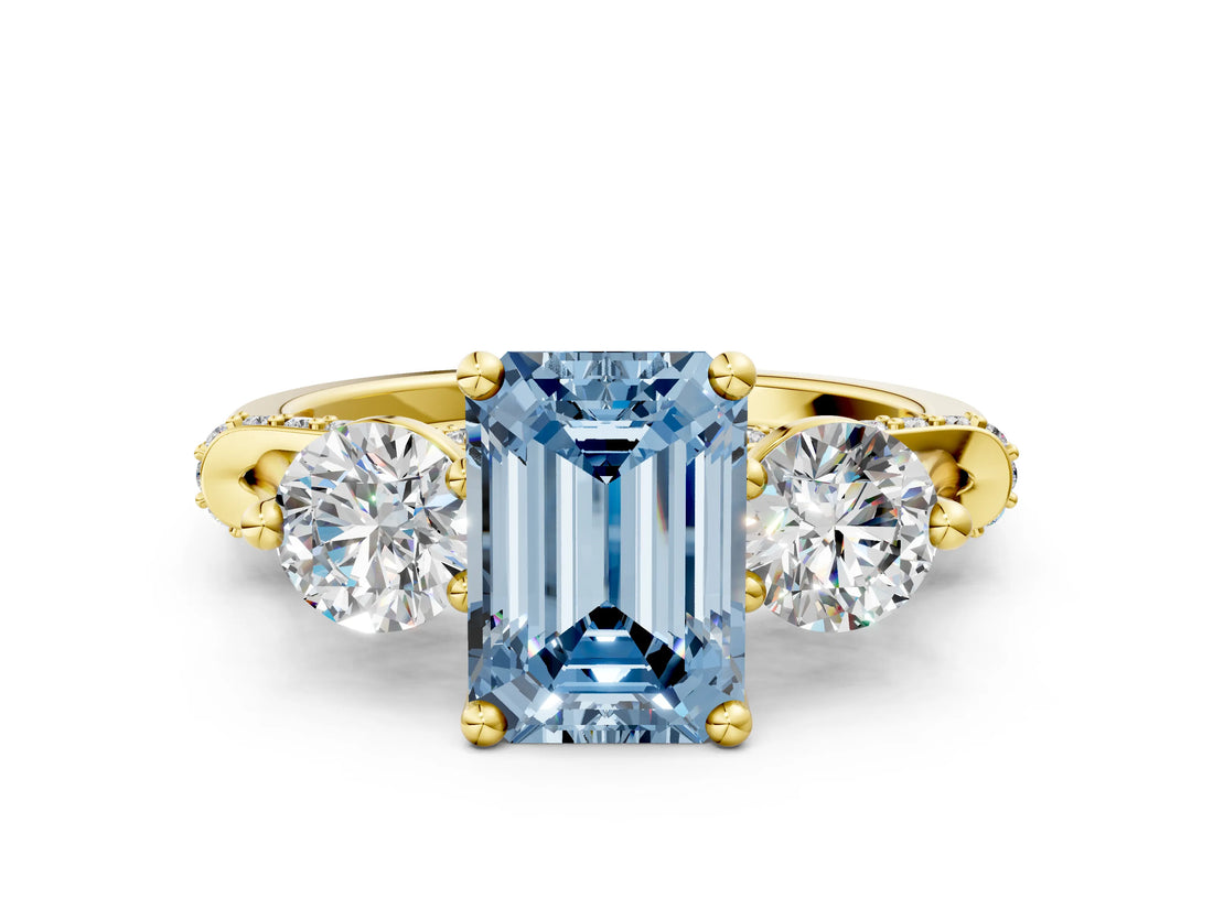 Yellow gold Fancy Blue Emerald Cut Diamond Three-Stone Ring with Prong Setting and Pavé Band