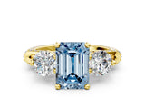 Yellow gold Fancy Blue Emerald Cut Diamond Three-Stone Ring with Prong Setting and Pavé Band