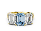 Yellow gold Fancy Blue Emerald Cut Diamond Three-Stone Ring with Prong Setting and Textured Band