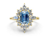Yellow gold Fancy Blue Emerald Cut Halo Diamond Cluster Ring with Marquise and Round Stones on a White Gold Band with Prong Setting
