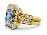Yellow gold Fancy Blue Emerald Cut Halo Diamond Engagement Ring with Pave Split Shank and Four-Prong Setting