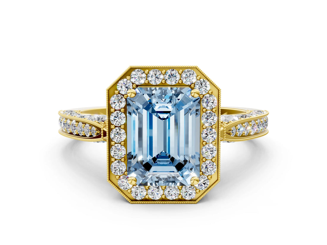 Yellow gold Fancy Blue Emerald Cut Halo Diamond Engagement Ring with Split Shank Band and Four-Prong Setting