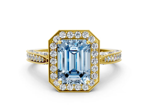 Yellow gold Fancy Blue Emerald Cut Halo Diamond Engagement Ring with Split Shank Band and Four-Prong Setting